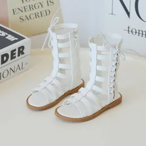 White high-top gladiator sandals for girls featuring cutout straps and side zipper closure