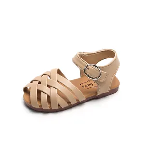 Sandali intrecciati beige da bambina con fibbia regolabile e suola in gomma morbida