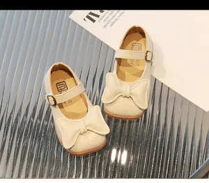 Top view of cream Mary Jane shoes for girls with large bow and square toe design