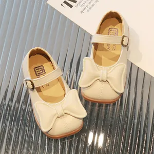 Chic girls cream Mary Jane flats with bow and adjustable strap for spring or autumn