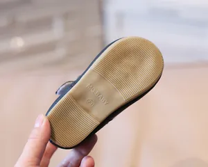 Detail of non-slip rubber sole with texture and size mark for toddler princess shoes