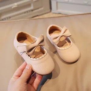 Pink princess toddler shoes with bow tie and scallop trim for girls in soft leather