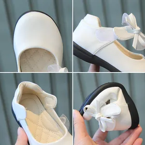 Girls' white Mary Jane shoes with bow detail and flexible soft soles for comfort