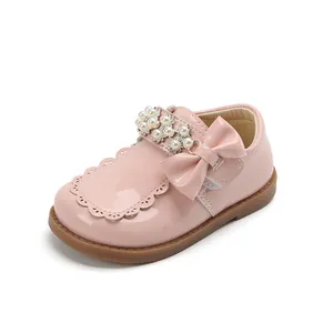 Pink patent leather girls princess shoes with pearls, rhinestones and bow detail