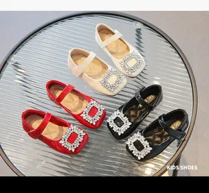 Top view of girls patent leather Mary Janes with sparkling crystal buckles in three colors