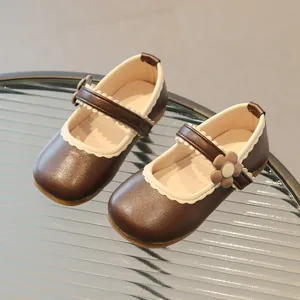 Brown Mary Jane shoes for girls with white scalloped trim and 3D flower decoration
