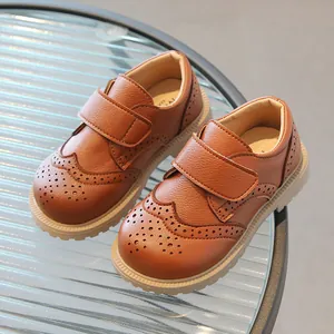 Brown leather brogue shoes for kids with velcro straps and anti-slip rubber soles