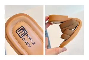 Detail of flexible rubber sole and soft brown leather insole for kids sandals