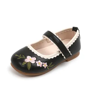 Black girls Mary Jane shoes with floral embroidery and white scalloped trim details
