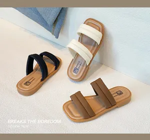 Detailed view of children's soft leather sandals in black, beige, and brown color options