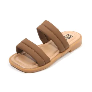 Minimalist summer slides for girls with padded cross-straps in soft taupe synthetic leather
