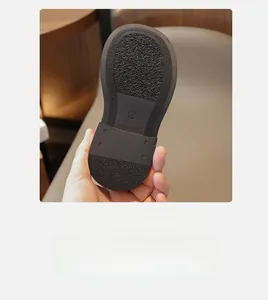 Detailed close-up of a non-slip rubber sole for children boots with size 27 marking