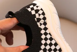 Close-up showing the high elasticity and breathable knit material of the kids sneaker