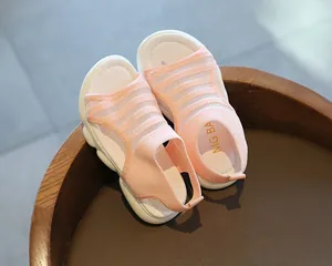 Detail view of pink girls sandals with breathable mesh and thick white wavy sole