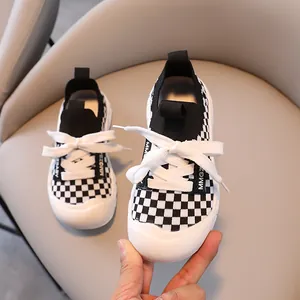 Kids' black and white checkerboard knit sneakers with protective thick rubber toe cap