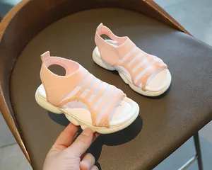 Close-up of pink girls' sports sandal with breathable mesh and thick white cushioned sole