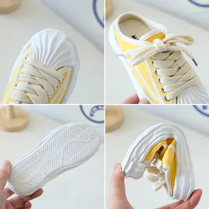 Flexible yellow canvas mule sneakers for kids with anti-slip rubber shell toe sole