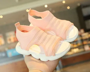 Close-up of pink knitted baby sandals featuring breathable mesh and thick soft soles
