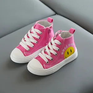 Sneakers alte in tela rosa per bambini con faccina gialla e cerniera laterale pratica