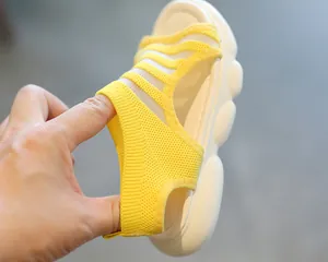 Close-up of flexible knit upper and elastic heel on yellow girls' summer sandals