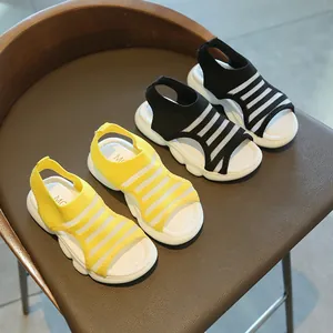 Girl's breathable knit flat sandals in yellow and black with thick wavy soles