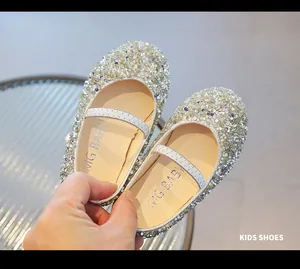Close-up of sparkling silver sequins and soft sole texture on children princess shoes