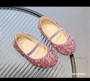 Macro detail of pink sequin girls' Mary Jane shoes with soft sole and elastic strap