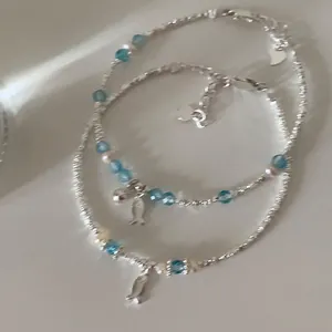 Elegant blue crystal silver fish beaded bracelet with heart charm and small pearls