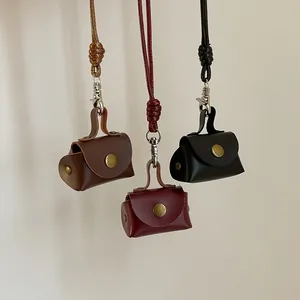 Mini collier porte-monnaie en cuir vintage en marron, bordeaux et noir élégant