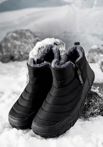 Detailed view of insulated waterproof snow boot with thick grey faux fur lining and zipper