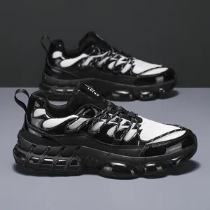 Classic black and white chunky mesh sneakers with breathable panels and thick sole