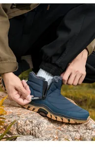 Detail of waterproof men's winter snow boot featuring side zipper and warm fleece lining