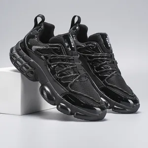 Macro side view of black breathable mesh and shiny patent leather panels on chunky sneaker