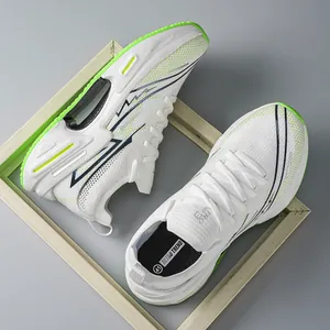 Top view of breathable mesh running shoe with white, navy accents and green sole detail