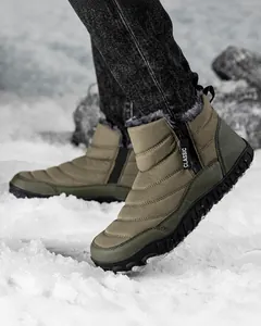 Detail of men's winter snow boot with thick faux fur lining and side zipper closure