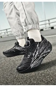 Close-up of running shoes with black mesh upper and rotating knob lacing system