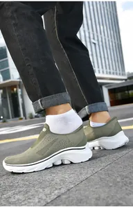 Detail view of army green slip-on shoes with breathable mesh and thick cushioned soles