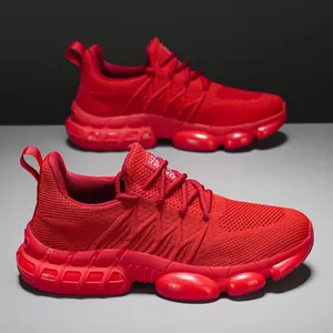 Red lightweight cushioned running shoes for men with breathable knit and bubble sole