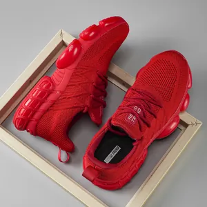Red knit running shoes with lightweight cushioned bubble sole and stylish chunky design