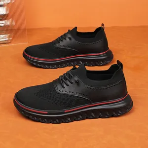 Black mesh men's slip-on sneakers with brogue detailing and red striped thick soles