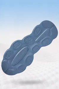 Detail of the blue-grey cushioned outsole with anti-slip tread for athletic sneakers