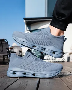 Detail of breathable knit upper and hollow cushioning sole on grey-blue walking shoes
