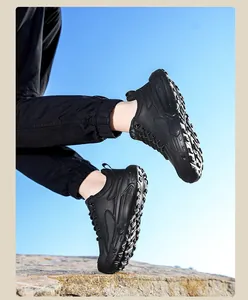 Dynamic low-angle shot of a black platform sneaker for men with a leather texture