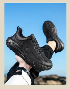 Close-up of black leather casual sneakers showing durable stitching and side vents