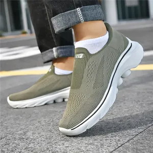 Olive green slip-on men sneakers with breathable mesh fabric and white cushioned sole