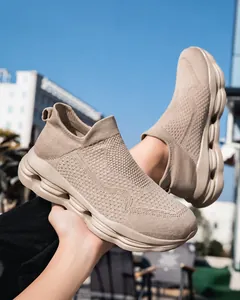 Detail of khaki flyknit sock sneaker showing breathable mesh texture and hollowed thick sole