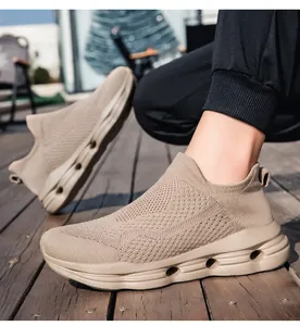Detail of beige knit sports sneaker showing breathable mesh and shock-absorbing hollow sole