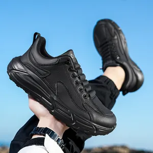 Men's wide-fit black leather running shoes with thick anti-slip soles and textured finish