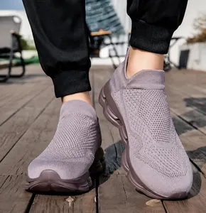 Outdoor street shot of breathable mauve knit sock shoes with chunky wave cushions