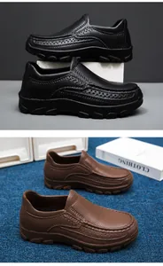 Detail of black and brown loafers featuring breathable perforated sides and lychee texture